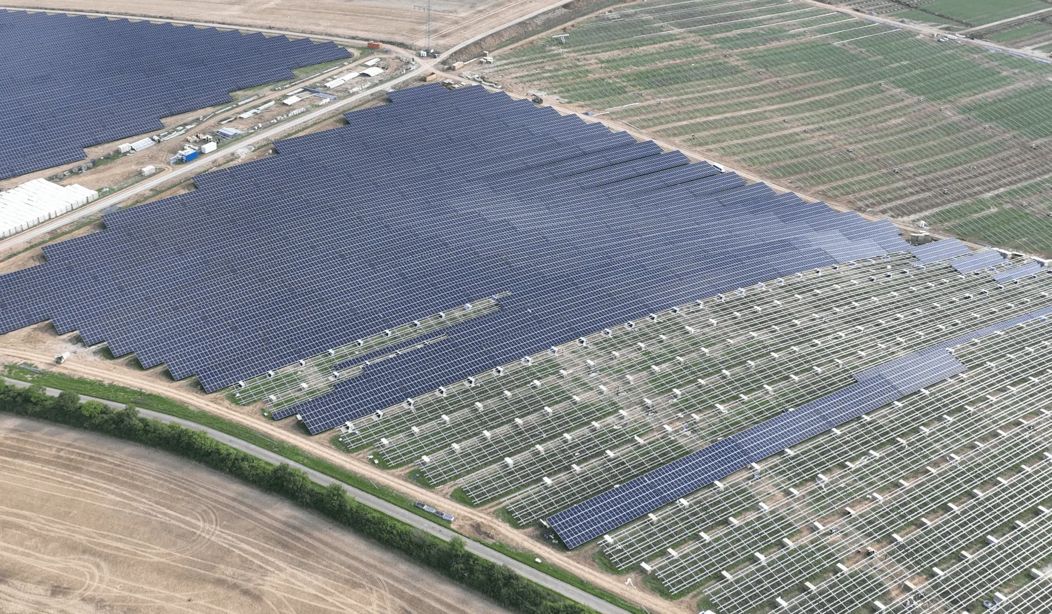 Renewable energy project site with solar panels used in AIM Solutions execution services